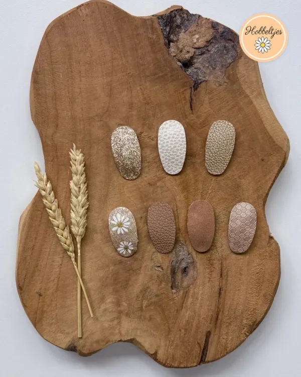 Acht antislip haarclipjes in goud, wit, bruin en roségoud met glitter en een madeliefje
