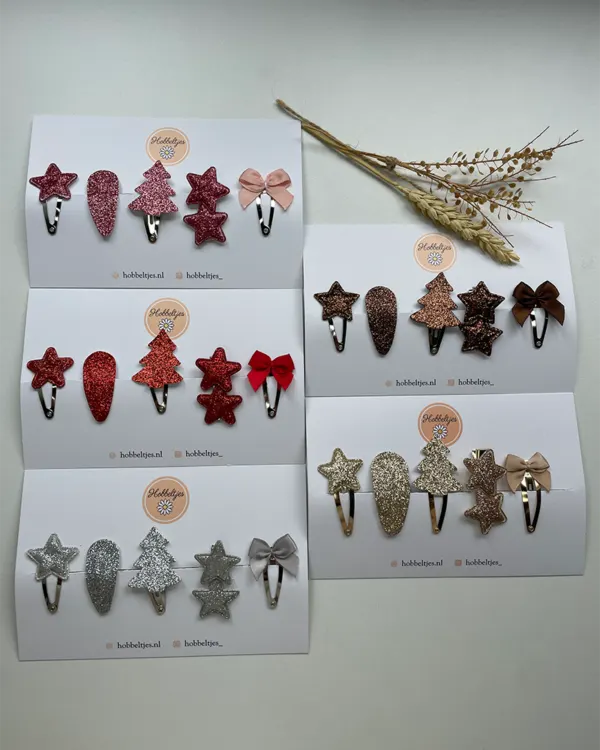 Kersthaarspeldjes in zilver, roze, rood, goud en brons met sterren