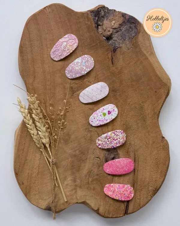 Zeven antislip haarclipjes in roze tinten met glitter en printjes