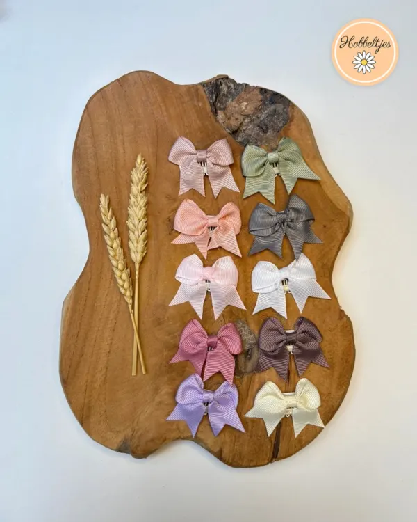 Tien antislip haarclipjes met strikjes in pastelkleuren, grijs, groen en mauve met parelknoopje